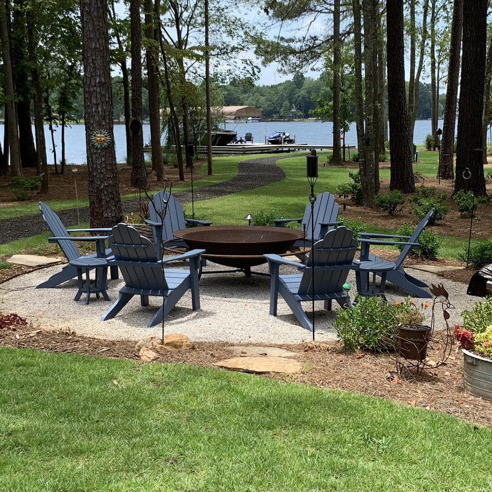 firepit and adirondack chairs around it. All in the perfect lake setting | what makes a good house guest | Positively Jane  