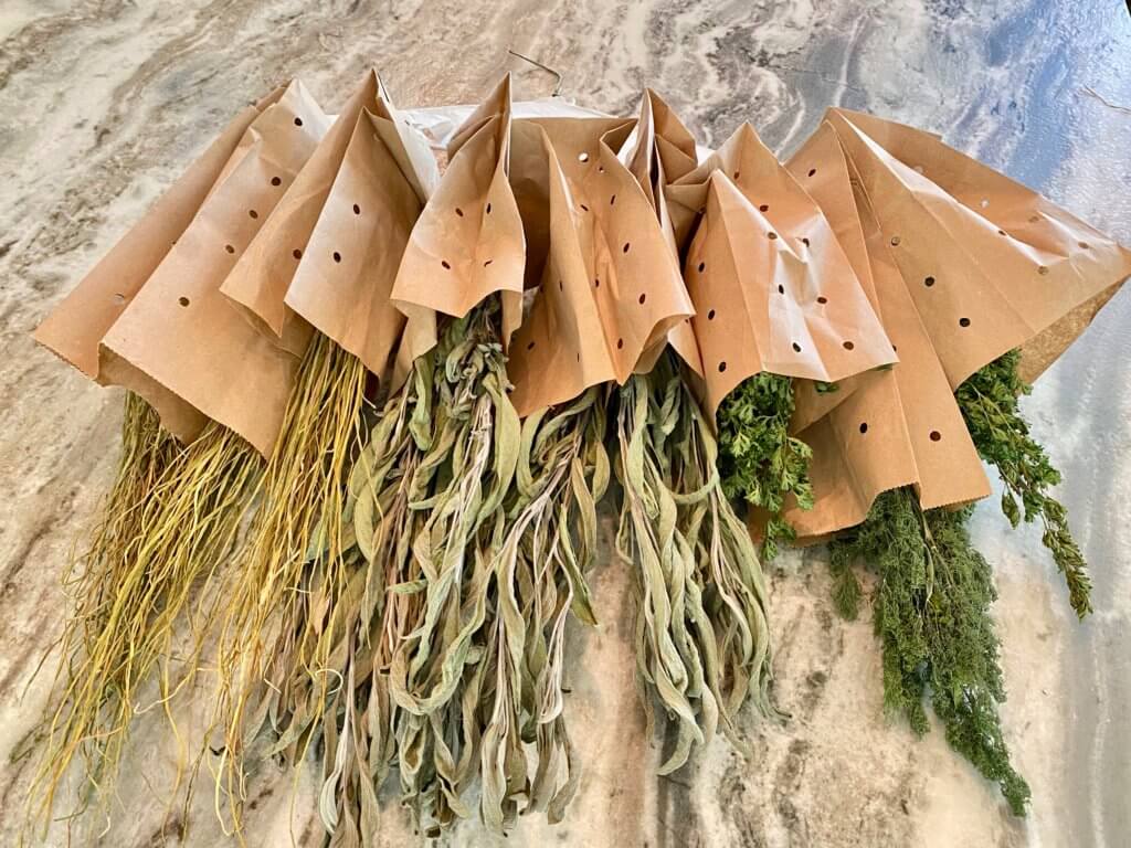 herbs in paper bags that have been dired