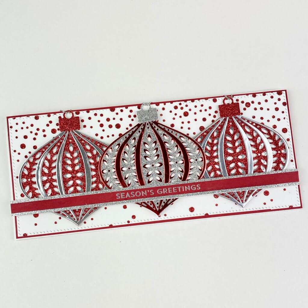 3 ornaments on a Christmas Card