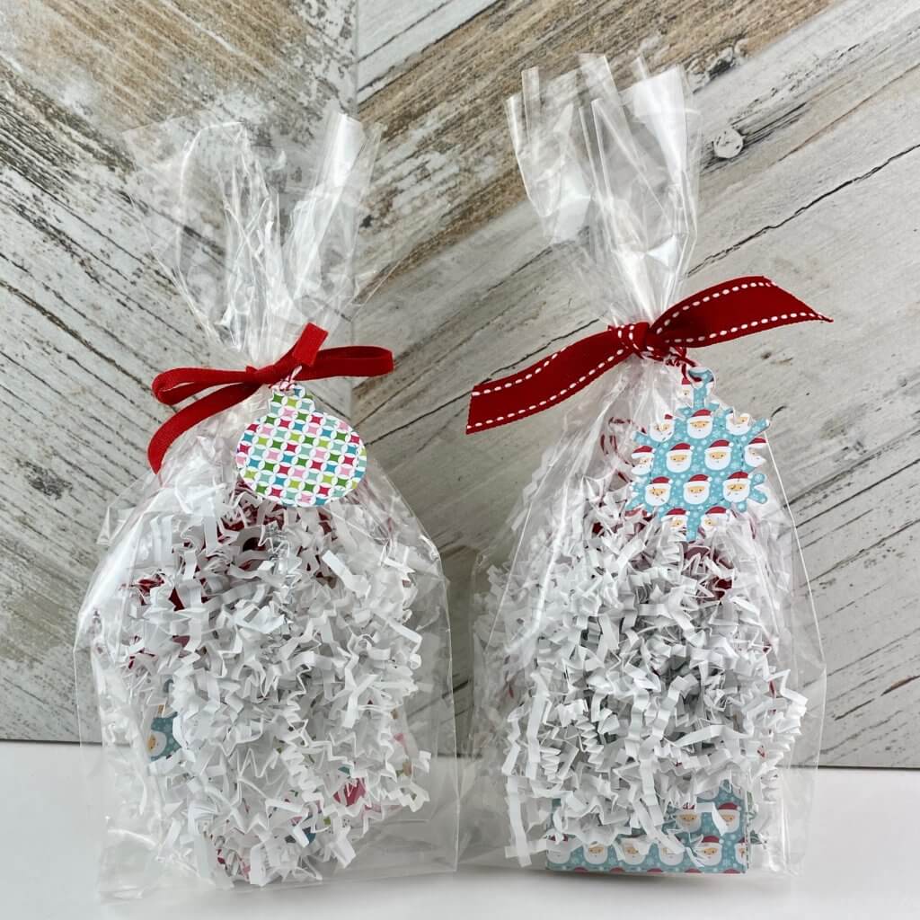 gifts wrapped in a clear bag and tied with a bow