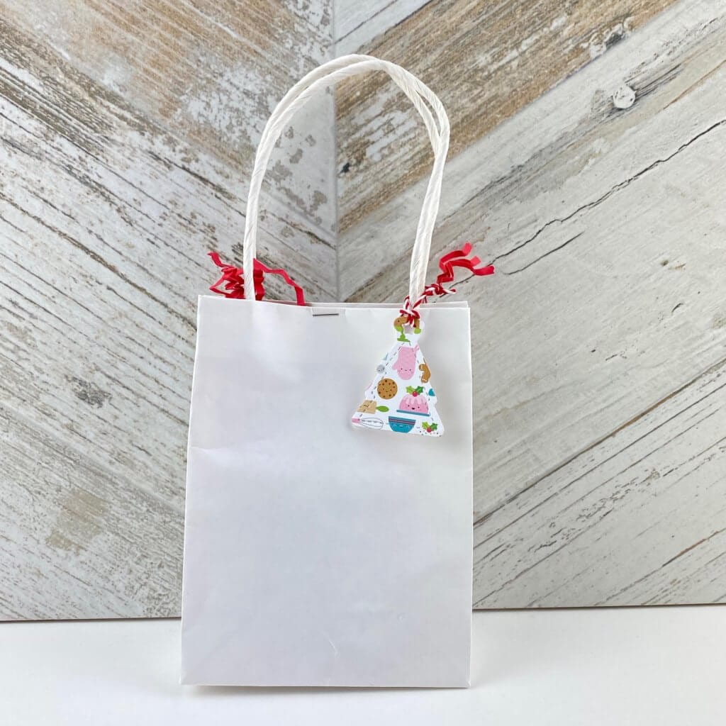 white bag with a gift tag