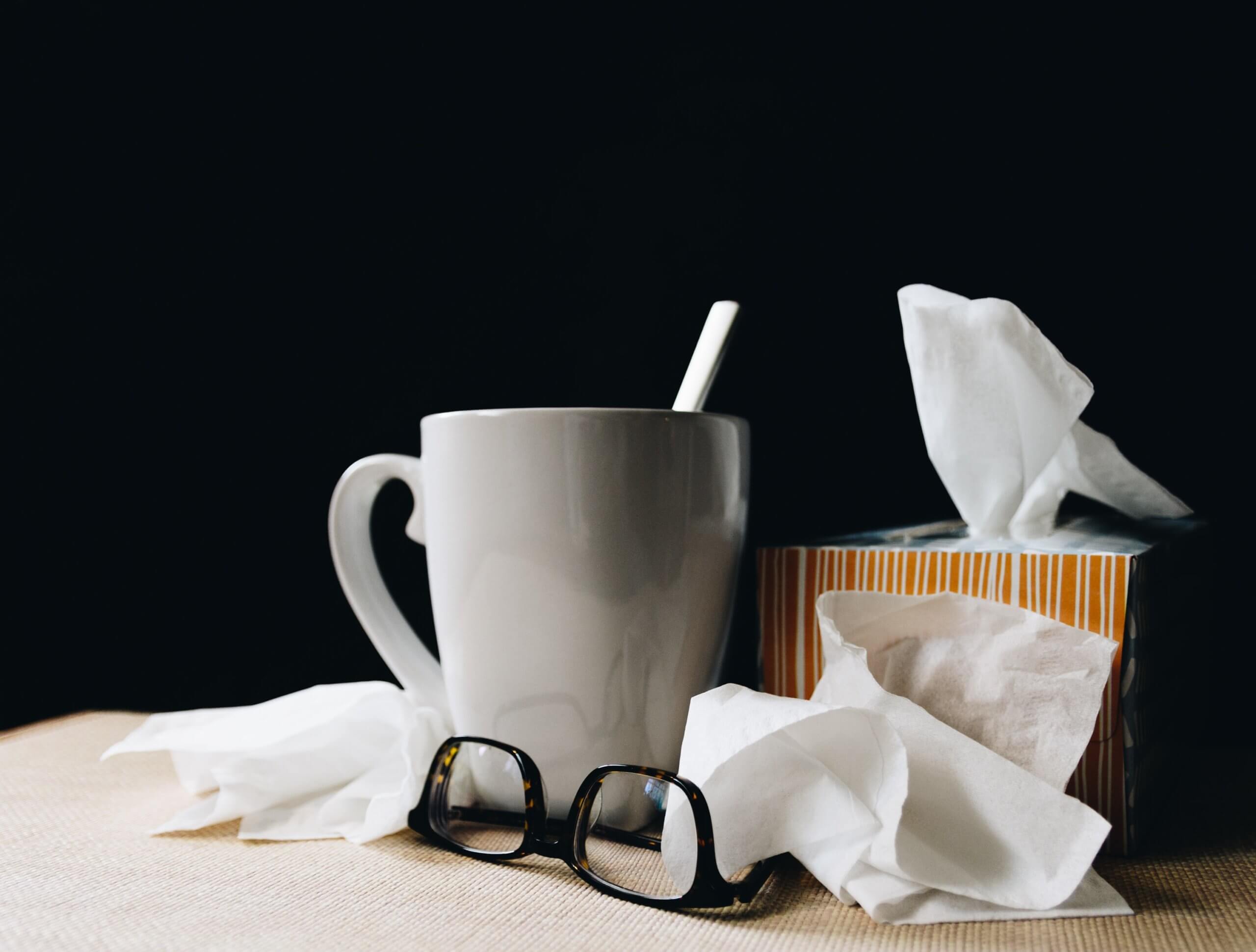 tissues, cup of tea and glasses