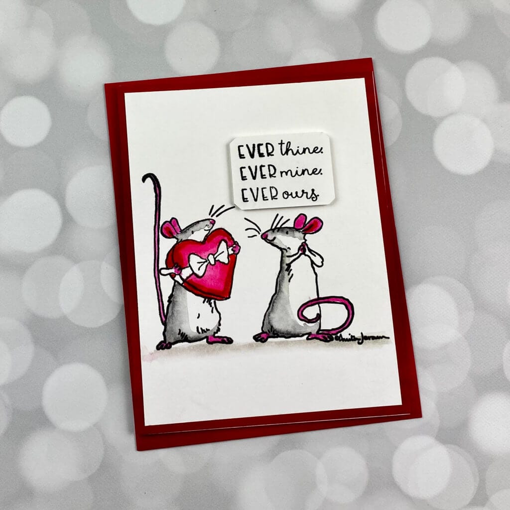 2 mice looking at each other on a valentines day card