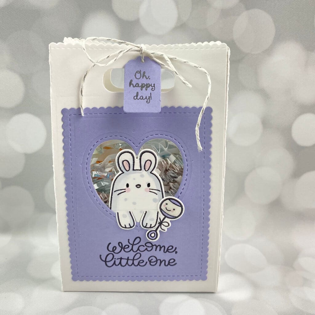 Handmade little bag about 4" tall with a lavendar face and a cute rabbit on the front | hosting a virtual baby shower | Positively Jane 