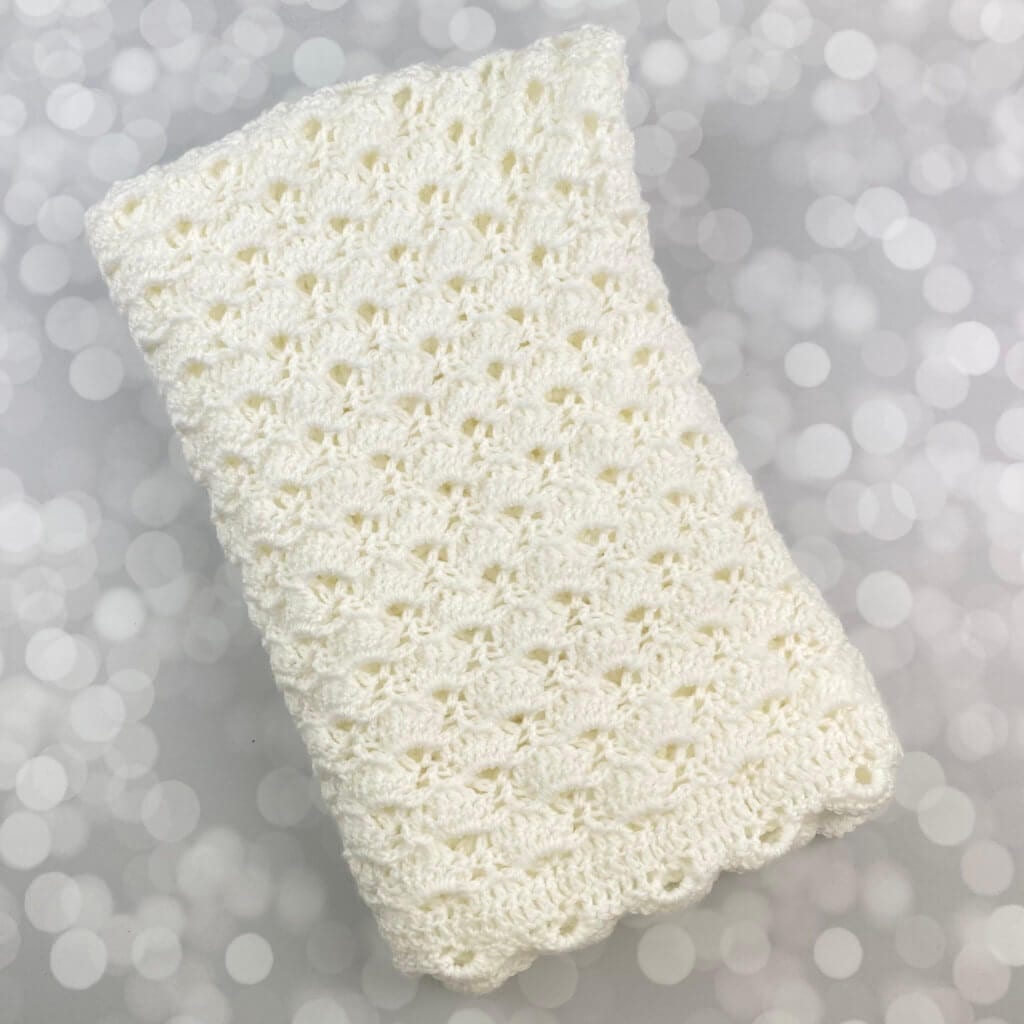 hand crochet baby blanket folded nicely