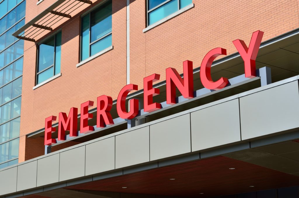image of the outside of an emergency room with the word emergency spelled out | emergency fund benefits | Positively Jane