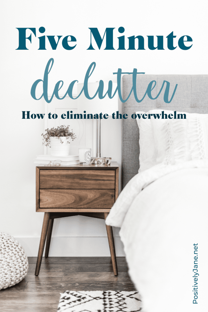 nicely made bed with a night stand with the words five minute declutter pin for pinterest | 5 minute declutter | Positively Jane  