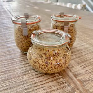 3 jars of homemade mustard sitting on a table | homemade whole grain mustard | Positively Jane