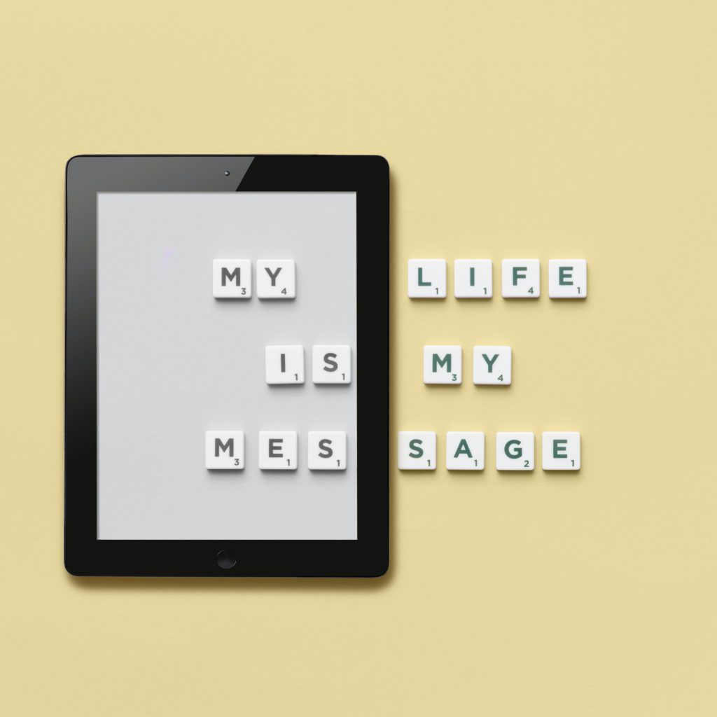 ipad on table with scrabble tiles on top. Says 'my life is my message' | the little things in life add up  | Positively Jane.