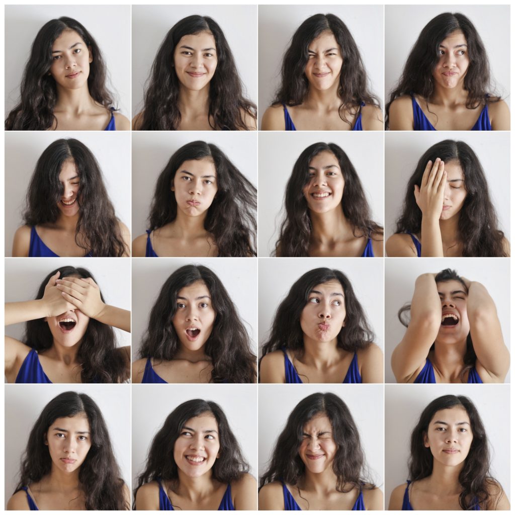 image with 16 little squares. The same women is in each square and in each one she has a different face expression | where do emotions come from | Positively Jane