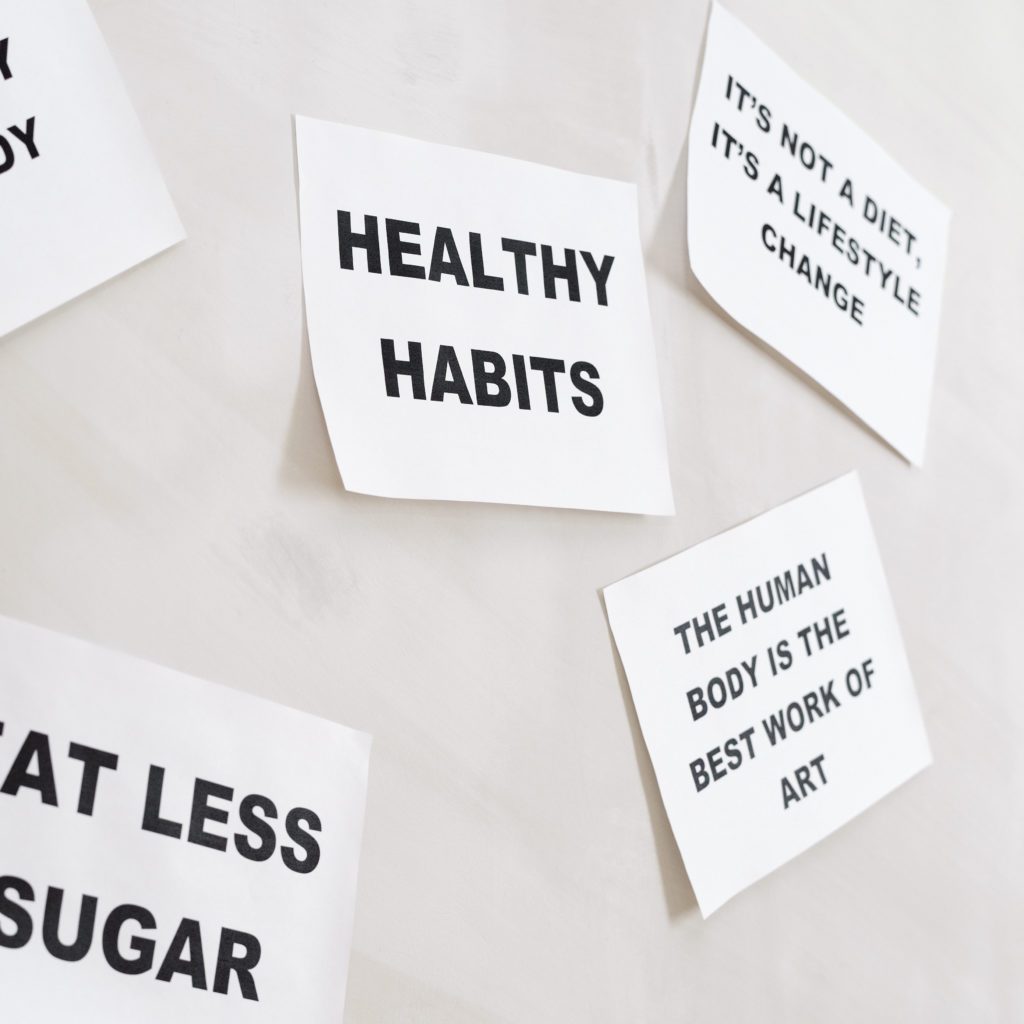 phrases on white post it notes. Healthy habits. Eat less sugar. Your body is a machine | 15 healthy habits | Positively Jane  