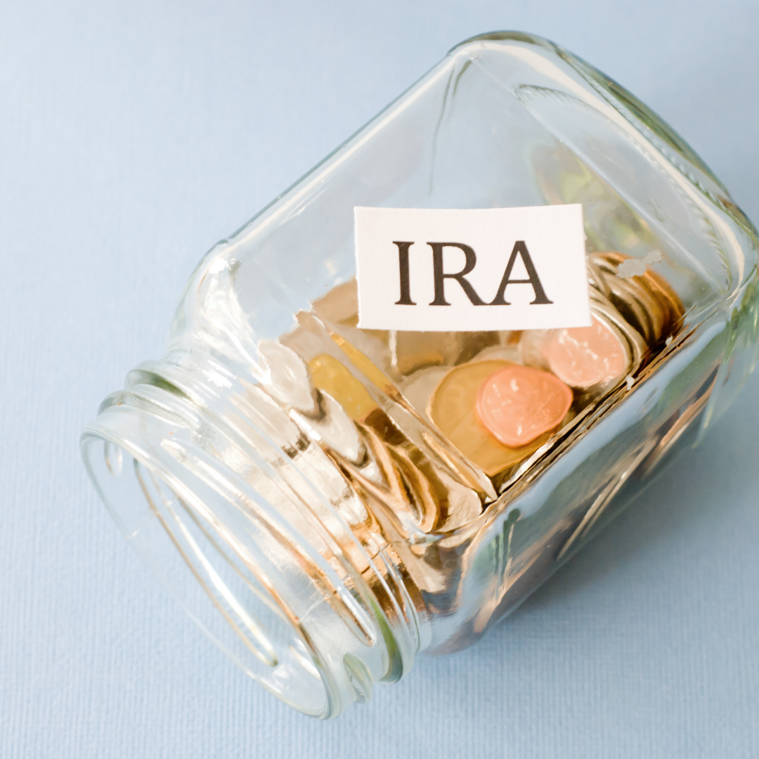 glass bottle with coins in it and the letters IRA on top | learn about iras\positivelu jane